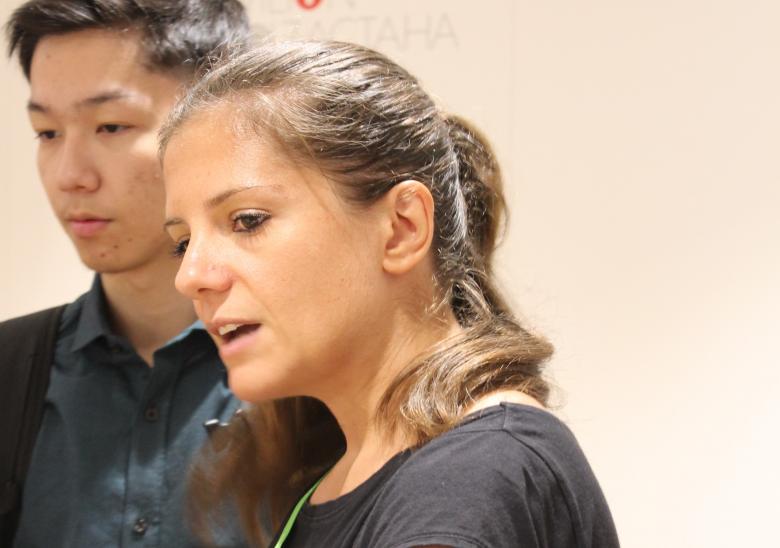 PhD Student Alessandra Motz explaining the game to a visitor