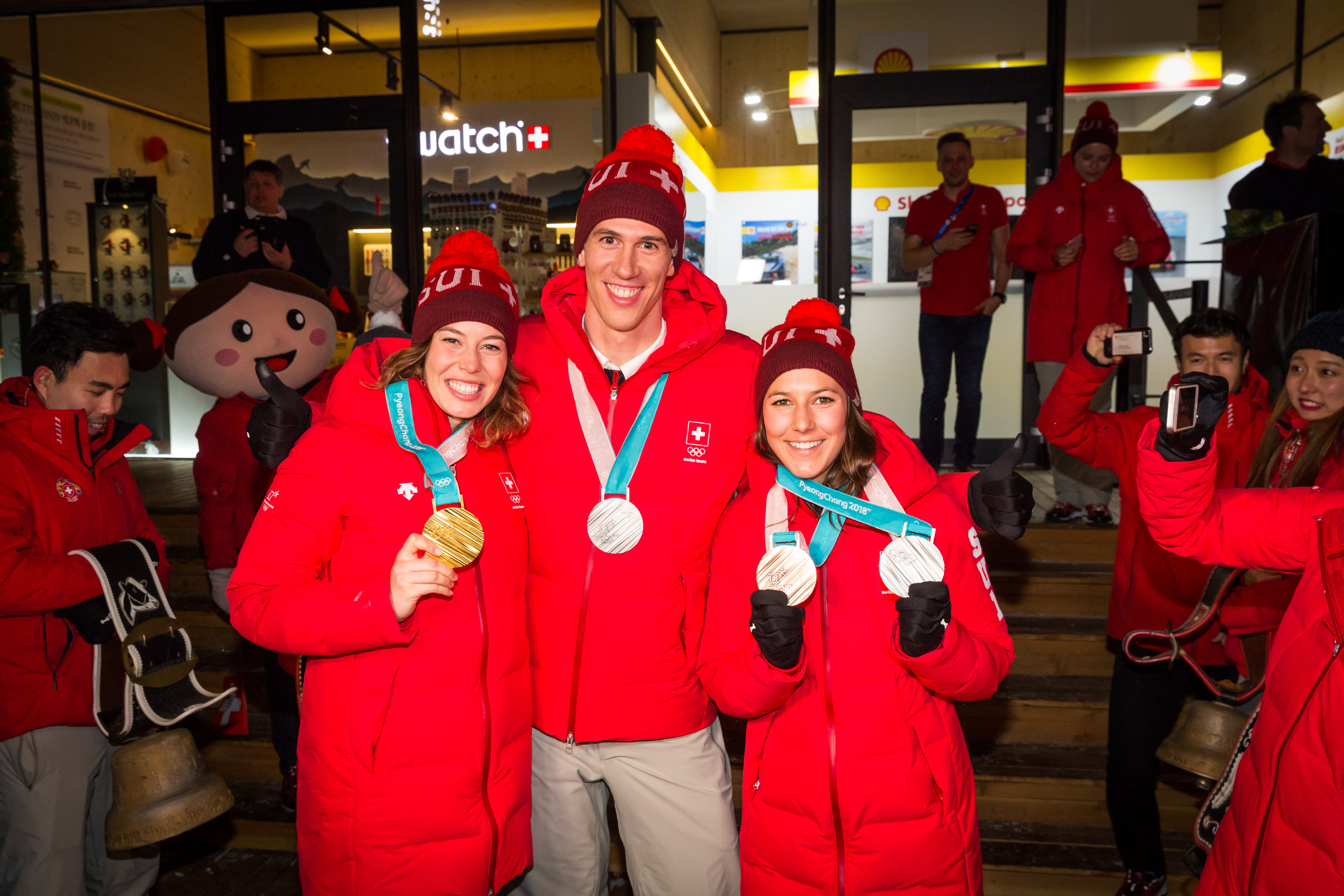 Michelle Gisin, Ramon Zenhäusern and Wendy Holdener in Pyeongchang in 2018