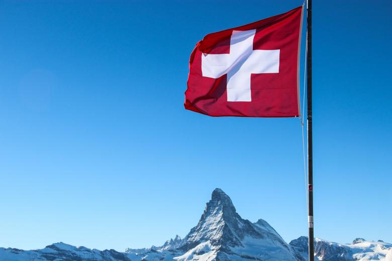Swiss Flag over Matterhorn Mountain