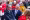 Federal Councillor Ignazio Cassis interacting with guests during a public event surrounded by spectators and event staff.