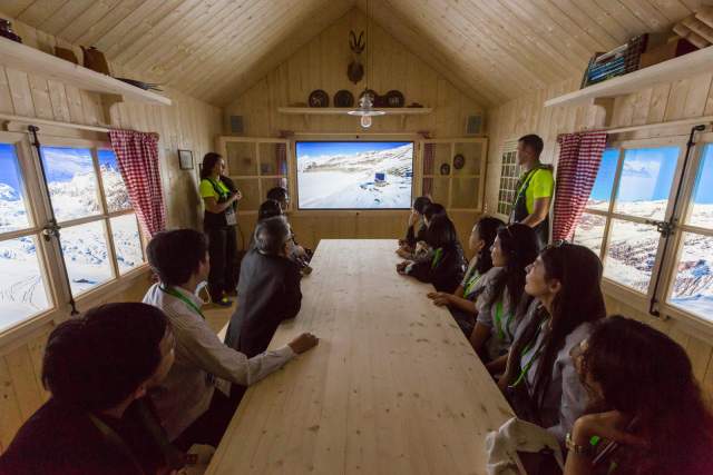 Guests discover an Alpine-themed installation inside the Swiss Pavilion.