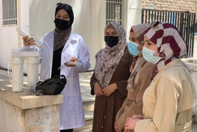 The EnviCoPal team presenting their water filters to the trainers during a field visit in Palestine ©Cewas.JPG